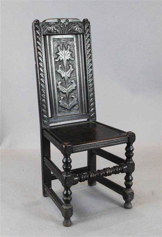 A late 17th century oak wood seat side chair	